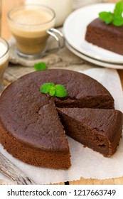 Homemade chocolate fondant cake with mellow filling with a leaf of mint for coffee - Shutterstock ID 1217663749