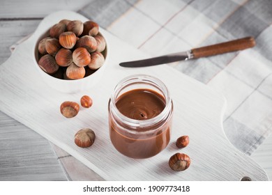 Homemade Chocolate Hazelnut Milk Spread on White wooden Background - Powered by Shutterstock