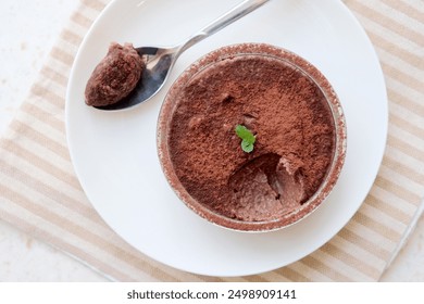 Homemade chocolate mousse (souffle) in a glass ramekins. Vegan chickpea and aquafaba  dessert. Clean eating concept. - Powered by Shutterstock