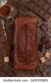 Homemade Chocolate Pound Cake Loaf. Delicious Dessert. The Ingredients And The Pie On The Baking Sheet. Selective Focus, Top View