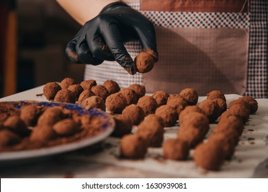 Homemade Chocolate Truffle. Candy Truffle. The process of making homemade chocolates. The process of making coffee truffle. Cooking chocolate truffles close-up on the table. Stock Photo