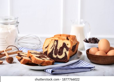 Homemade Chocolate and Vanilla Marble Loaf Cake. Sliced Served with Tea or Coffe. White Background