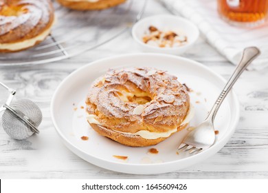 Homemade Choux Pastry Cake Paris Brest With Almond Flakes And Sugar Powder.