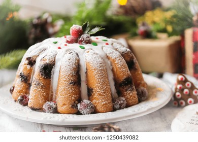 Homemade Christmas Bundt Cake With White Icing On Festive Holiday Background, Selective Focus / X-mas Mixed Fruit Cake