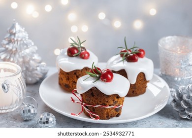 Homemade Christmas mini fruit cakes cupcakes with sugar icing frosting, traditional Christmas dessert - Powered by Shutterstock