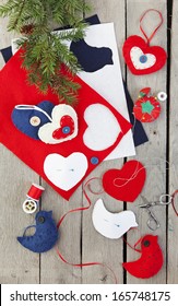 Homemade Christmas Ornaments Being Made From Felt, Ribbon, And Buttons.