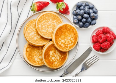 The homemade classic american pancakes with blueberries, raspberries and strawberries. Top view. - Powered by Shutterstock