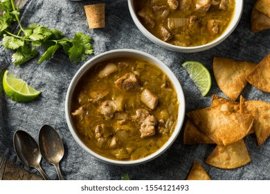 Homemade Colorado Pork Green Chili Soup With Chips And Lime