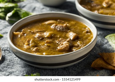 Homemade Colorado Pork Green Chili Soup With Chips And Lime