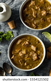 Homemade Colorado Pork Green Chili Soup With Chips And Lime