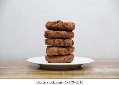 Homemade Cookies With Flaxseed, Oatmeal, Coconut And Nuts On A Wooden Table, Healthy Vegetarian