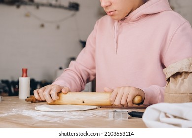 Homemade cooking teenage boy makes dough for pizza - Powered by Shutterstock