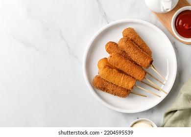 Homemade Corn Dogs. Traditional American Street Food. Fried Sausage On A Stick. Сorn Dog, Corndog On A White Plate. Top View, Copy Space.