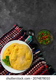 Homemade Corn Flatbread Cilantro Green Tomato Salsa Authentic Textile. Handmade Mexican Tortilla Vegetable Salad.Traditional Indian Punjabi Makki Ki Roti Bread Plate Top View Wheat Flour Dough Cuisine