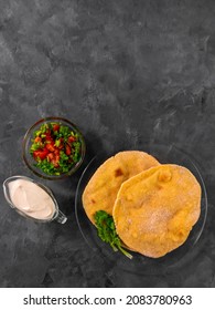 Homemade Corn Flatbread Cilantro Greens Tomato Salsa. Handmade Mexican Tortilla Taco Quesadilla Vegetable. Traditional Indian Makki Ki Roti Bread Top View. Gluten Free Flour Dough Authentic Cuisine.