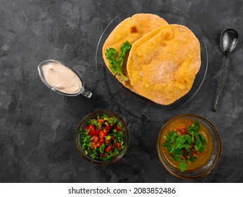 Homemade Corn Flatbread Cilantro Greens Tomato Salsa. Handmade Mexican Tortilla Taco Quesadilla Vegetable. Traditional Indian Makki Ki Roti Bread Top View. Gluten Free Flour Dough Authentic Cuisine.