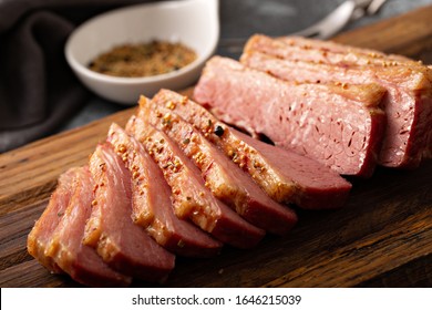 Homemade corned beef sliced on a cutting board