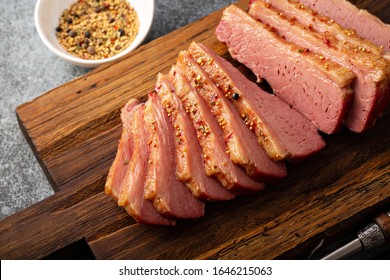 Homemade Corned Beef Sliced On A Cutting Board