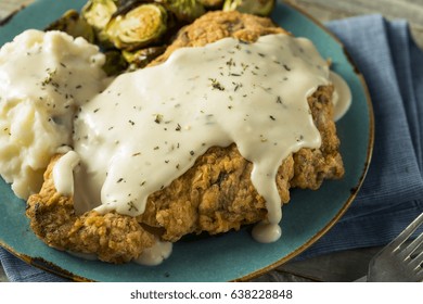 Homemade Country Fried Steak With Gravy And Potatoes