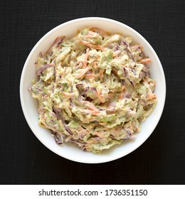 Homemade Creamy Broccoli Slaw In A White Bowl On A Black Surface, Top View. Flat Lay, From Above, Overhead. 