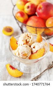 homemade creamy ice cream with peach in a glass bowl