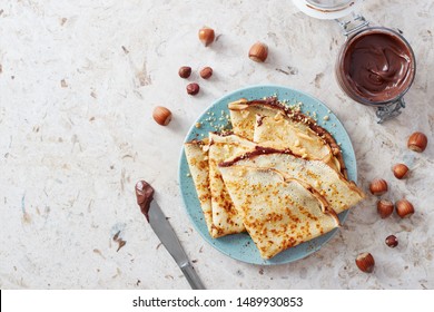 Homemade Crepes, Tasty Thin Pancakes With Chocolate And Nuts. 