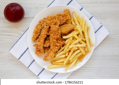 Homemade Crispy Chicken Tenders and French Fries on a white wooden background, top view. Flat  lay, overhead, from above. - Shutterstock ID 1786156211