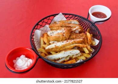 Homemade Crispy Chicken Tenders And French Fries , Top View. Flat Lay, Overhead, From Above.