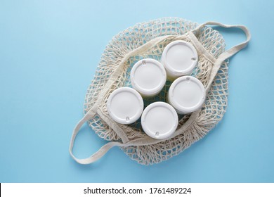 Homemade Crockpot Greek Yogurt In Glass Jars On Light Blue Background.