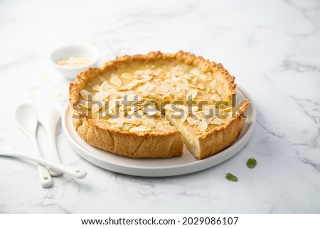 Homemade custard tart with almond flakes