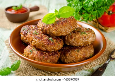 Homemade cutlets with oatmeal on a wooden table in a rustic style. Healthy food
