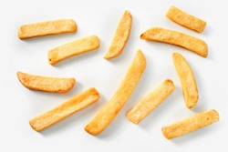 Homemade Deep Fried French Fries On A White Background In A Random Scatter Viewed From Above