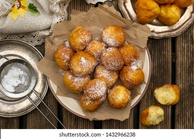 Homemade deep fried sweet ricotta fritters with powdered sugar - Shutterstock ID 1432966238