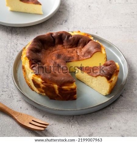 Homemade delicious sliced baked Basque Burnt Cheesecake in a plat served for eating.