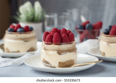 Homemade Delicious Tiramisu In Jar With Fresh Raspberry And Blueberry For The Breakfast