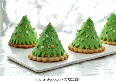 Homemade Dessert Christmas Tree Made Of Japanese Sponge Cake, Cream And Shortbread. Selective Focus.