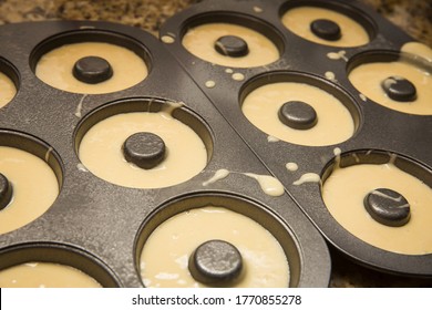 Homemade Donut Batter in Metal Donut Baking Pan