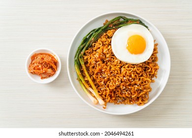 Homemade dried Korean spicy instant noodles with fried egg - Shutterstock ID 2046494261