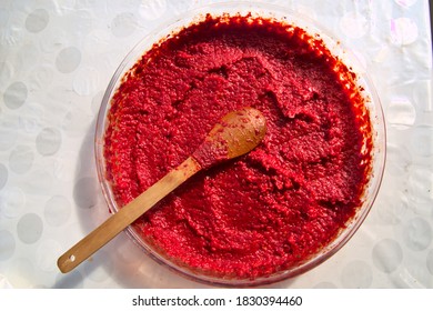 Homemade Dried Tomato Paste And Wooden Spoon.