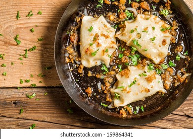 Homemade dumplings fried with onion and parsley - Powered by Shutterstock