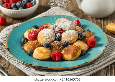 Homemade Dutch Poffertjes Mini Pancakes with Powdered Sugar