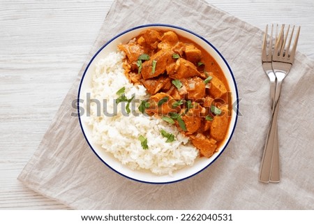 Homemade Easy Indian Butter Chicken with Rice on a Plate, top view. Flat lay, overhead, from above. 