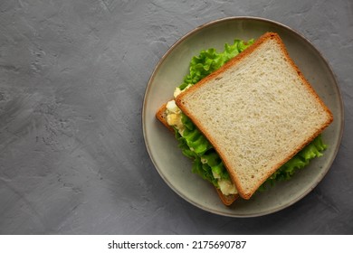 Homemade Egg Salad Sandwich With Lettuce On A Plate, Top View. Flat Lay, Overhead, From Above. Space For Text.