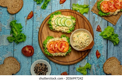 Homemade Egg Salad Sandwich With Wholewheat Bun,cucumber, Tomatoes,lettuce,egg,and Cream Cheese.  Rustic Style. Selective Focus. Top View. Copy Space.