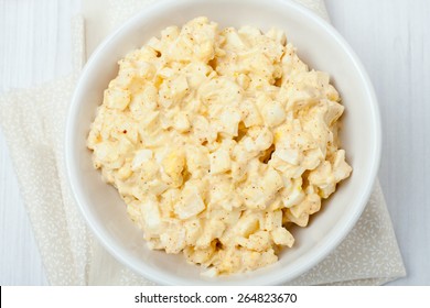 Homemade Egg Salad In White Bowl On White Background, Top View