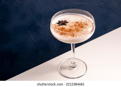 Homemade Eggnog With Cinnamon And Nutmeg In Martini Glass.