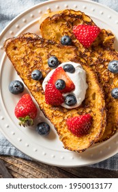 Homemade Eggnog French Toast with Whipped Cream and Berries