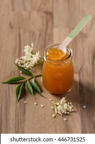 Homemade Elderflower Jam With Wooden Spoon In Small Jar. Selective Focus.