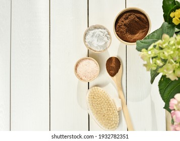 Homemade Exfoliating Scrub Ingredients. Coffee, Pink Salt, Clay Powder And Body Brush On Wooden Table. Spring Body Care, Cleansing And Renewal For Skin.