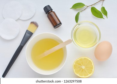 Homemade Face Mask For Acne, Lemon, Egg White, Tea Tree Oil, Cosmetic Brush, Flat Lay.